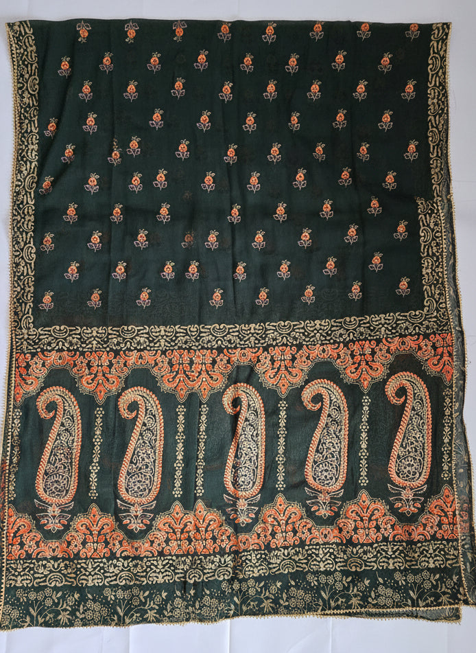 Black fabric with intricate gold and orange patterns on a white background