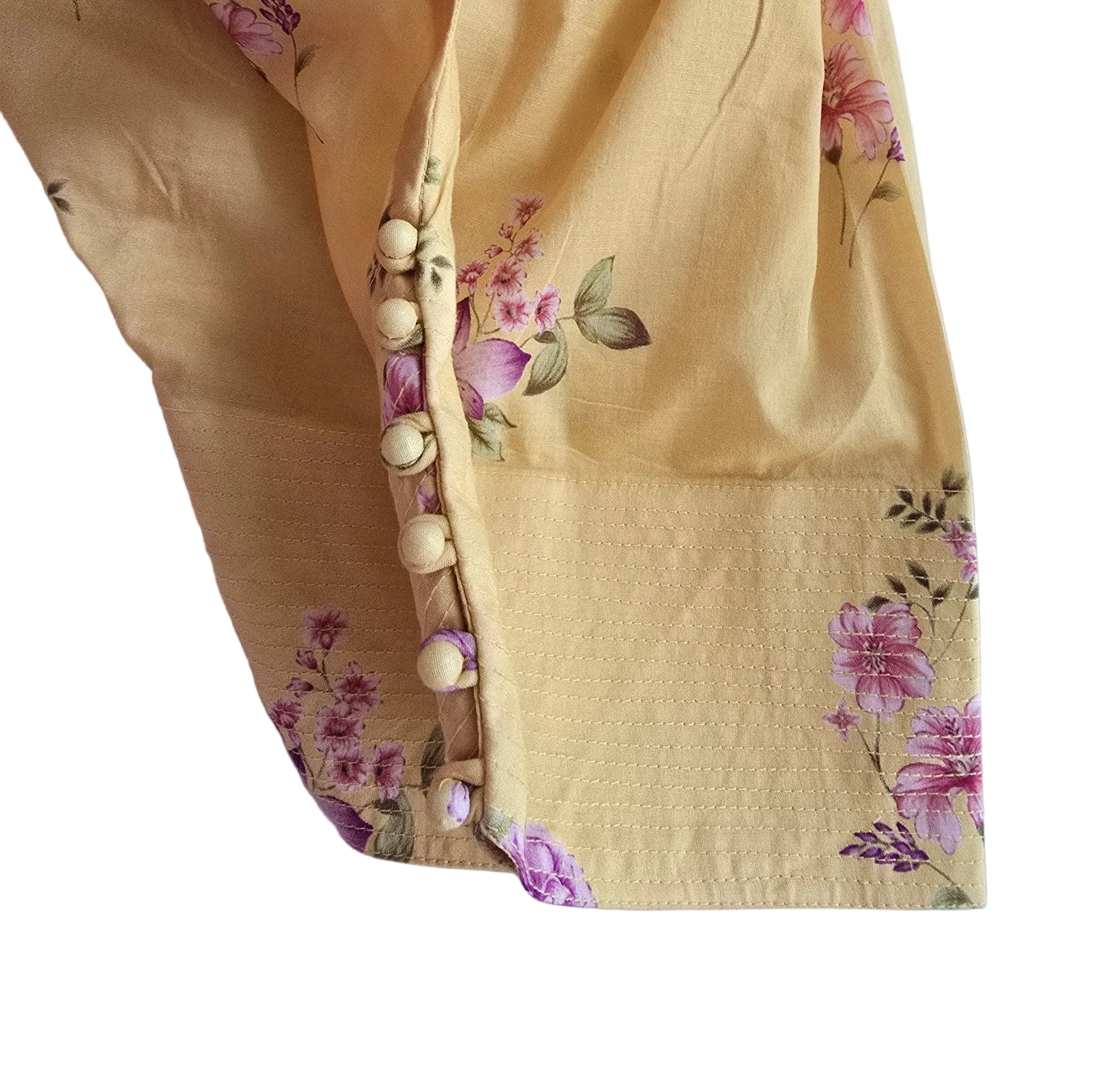 Yellow fabric with floral patterns on a white background
